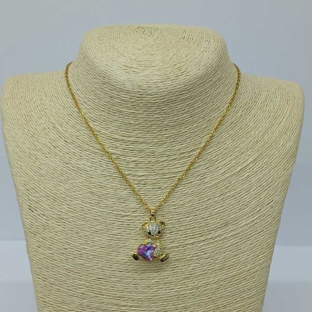Stainless steel necklace with pendant , New with tags , Color gold and purple